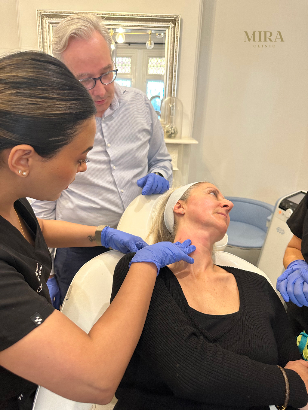 Krupali - demonstrating her mastery of a neck treatment with Dr Clark